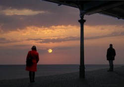 Waiting Apart Depressed Separated man and woman watching sunset