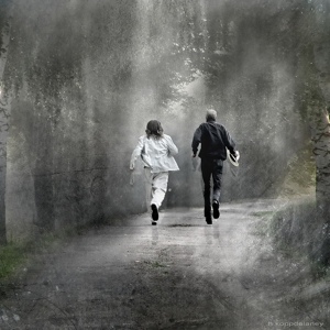 Two men hurrying along a path