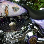 chrome-plated motorcycle engine with painting of girl