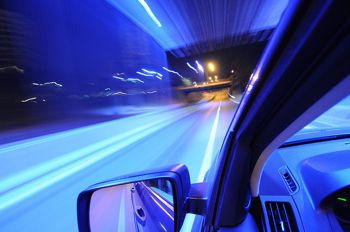speeding car in blue tunnel
