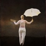 Woman balancing with umbrella