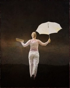 Woman balancing with umbrella